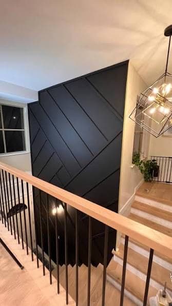 Black Faceted Double-Height Stair Wall design direction